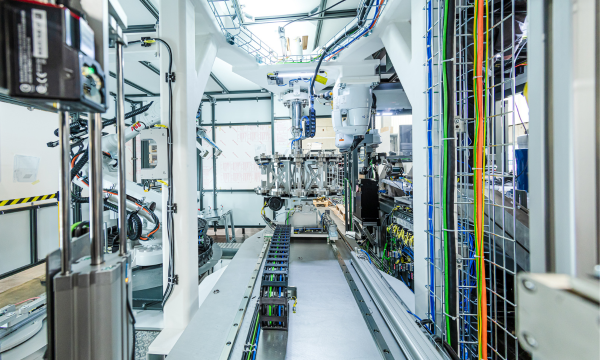 Robot system for automated component handling within an industrial plant