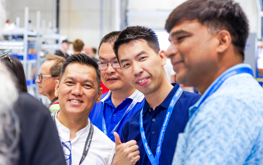 International employees and visitors talking during esmo AG’s Open House