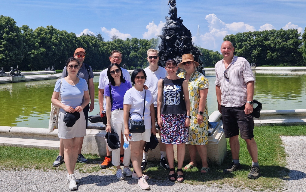 Group of international esmo colleagues on a team outing in a park.